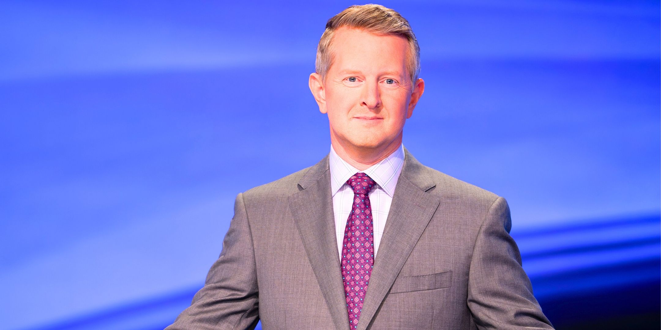 Jeopardy! host Ken Jennings looks into the camera lens
