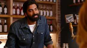 Joe leaning on the bar In Ginny And Georgia