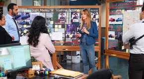 Kaitlin Olson's Morgan addresses the team in a busy office from High Potential