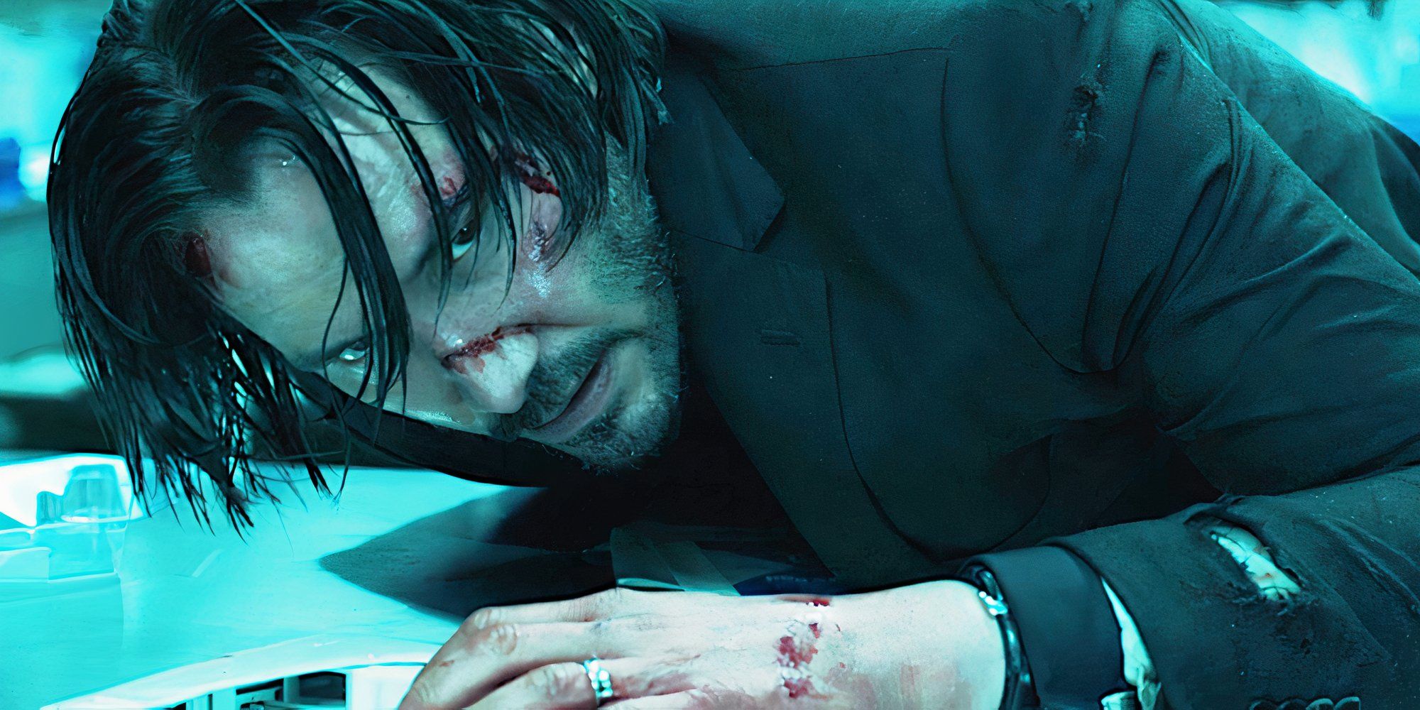 Keanu Reeves glares menacingly in a scene from John Wick