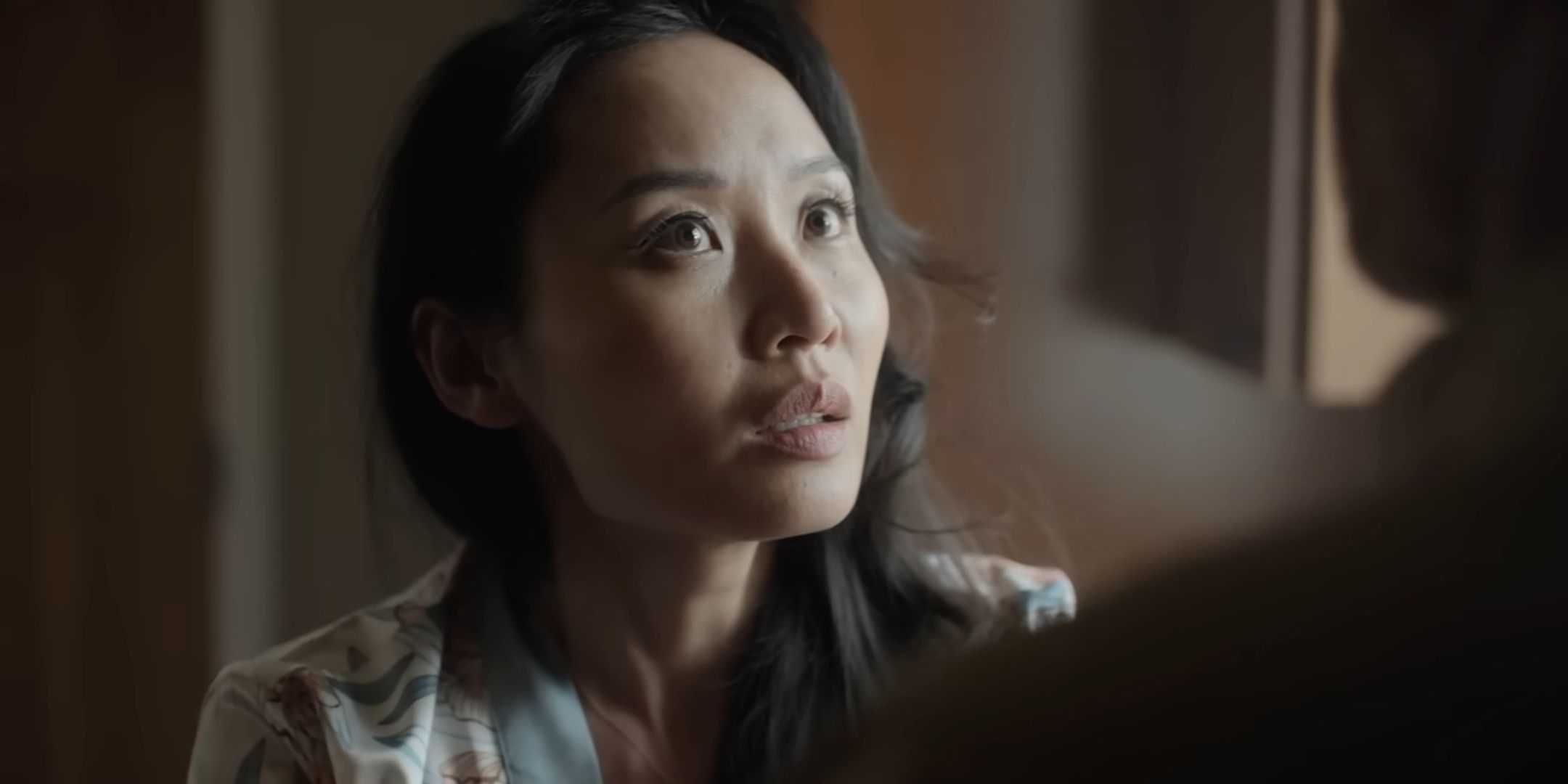 Li Jun Li as Alma looking worried at Ren in Alma and the Wolf
