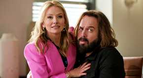 Lorna sitting on Cisco's lap in The Lincoln Lawyer