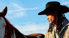 Love Island USA Season 7's Taylor Williams posing in a cowboy hat.