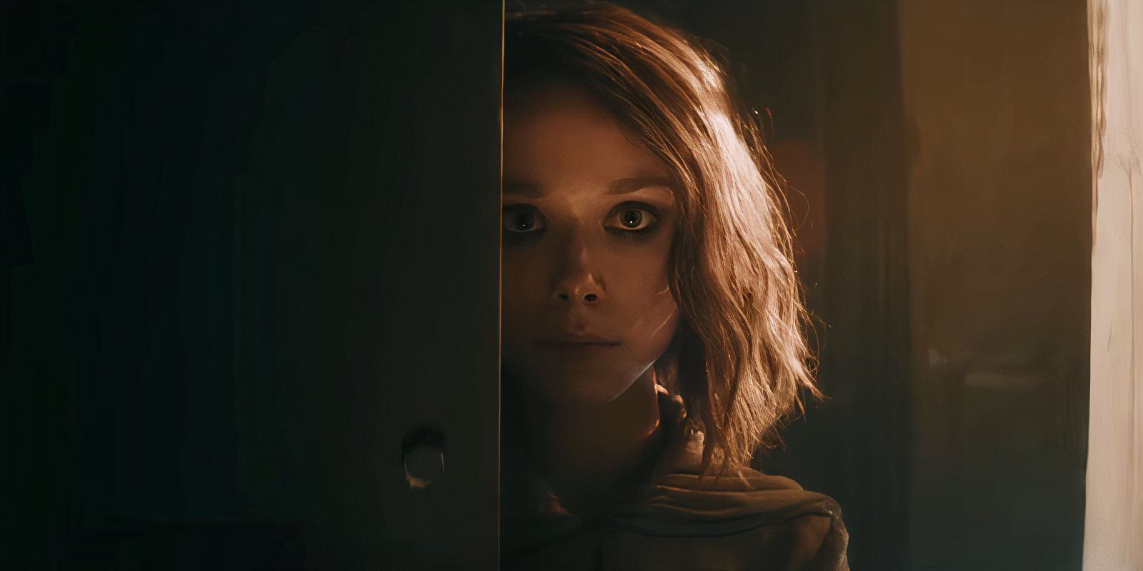 AMELIA hiding halfway behind a door in M3GAN 2.0