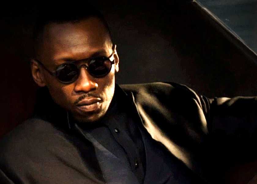 Mahershala Ali's Vector gets out of a car in Alita Battle Angel