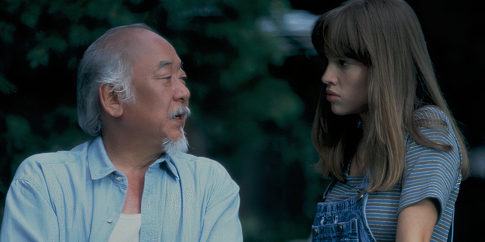 Pat Morita as Mr. Miyagi and Hilary Swank as Julie Pierce in The Next Karate Kid