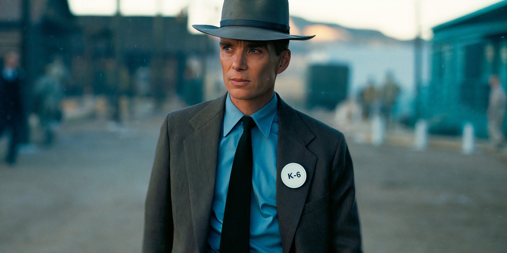 Cillian Murphy walks through in Oppenheimer.