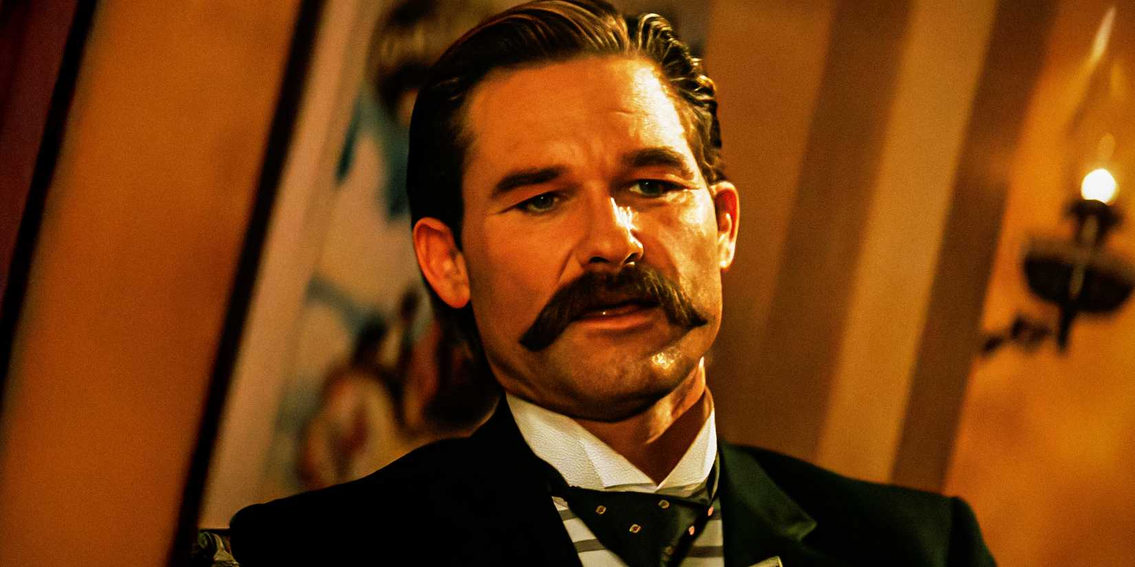 Kurt Russell has an intense conversation in a scene from Tombstone
