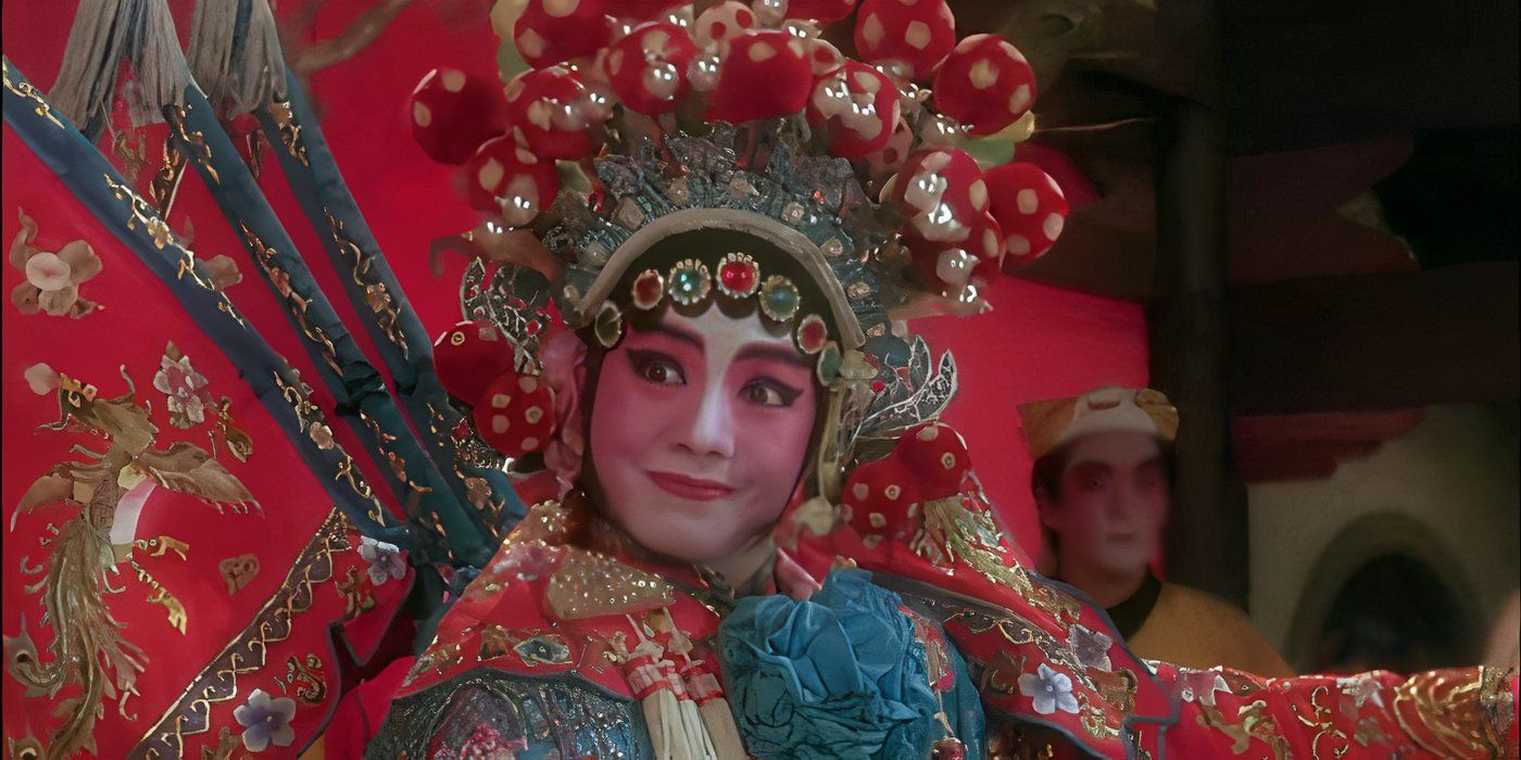 A woman looks concerned while wearing full stage makeup in Peking Opera Blues