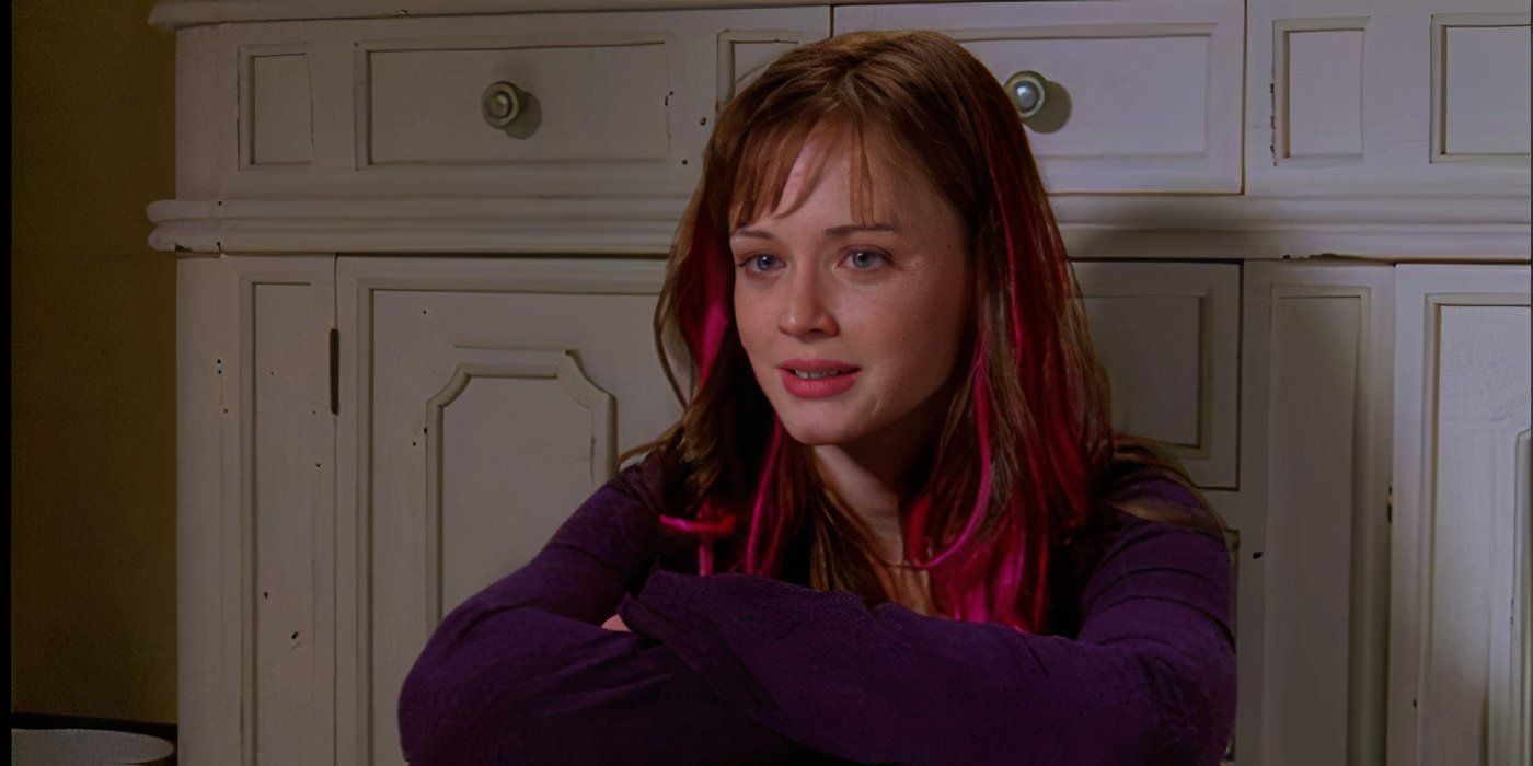 Rory (Alexis Bledel) with pink streaks in her hair sitting on the ground of her bathroom crying in Gilmore Girls season 7