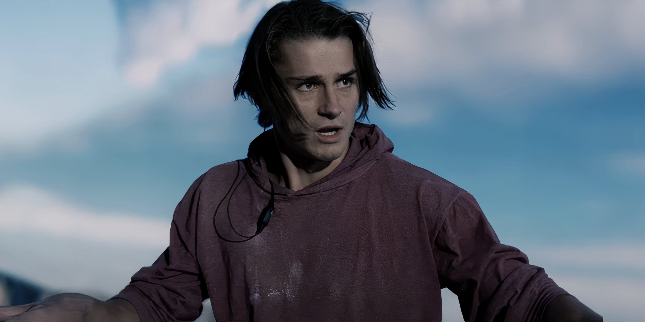 Sean standing on a mountain looking serious in The Sound