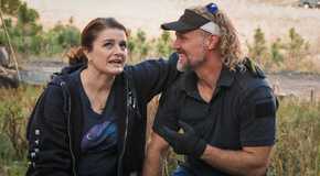 Sister Wives Robyn Kody Brown in black outside their house