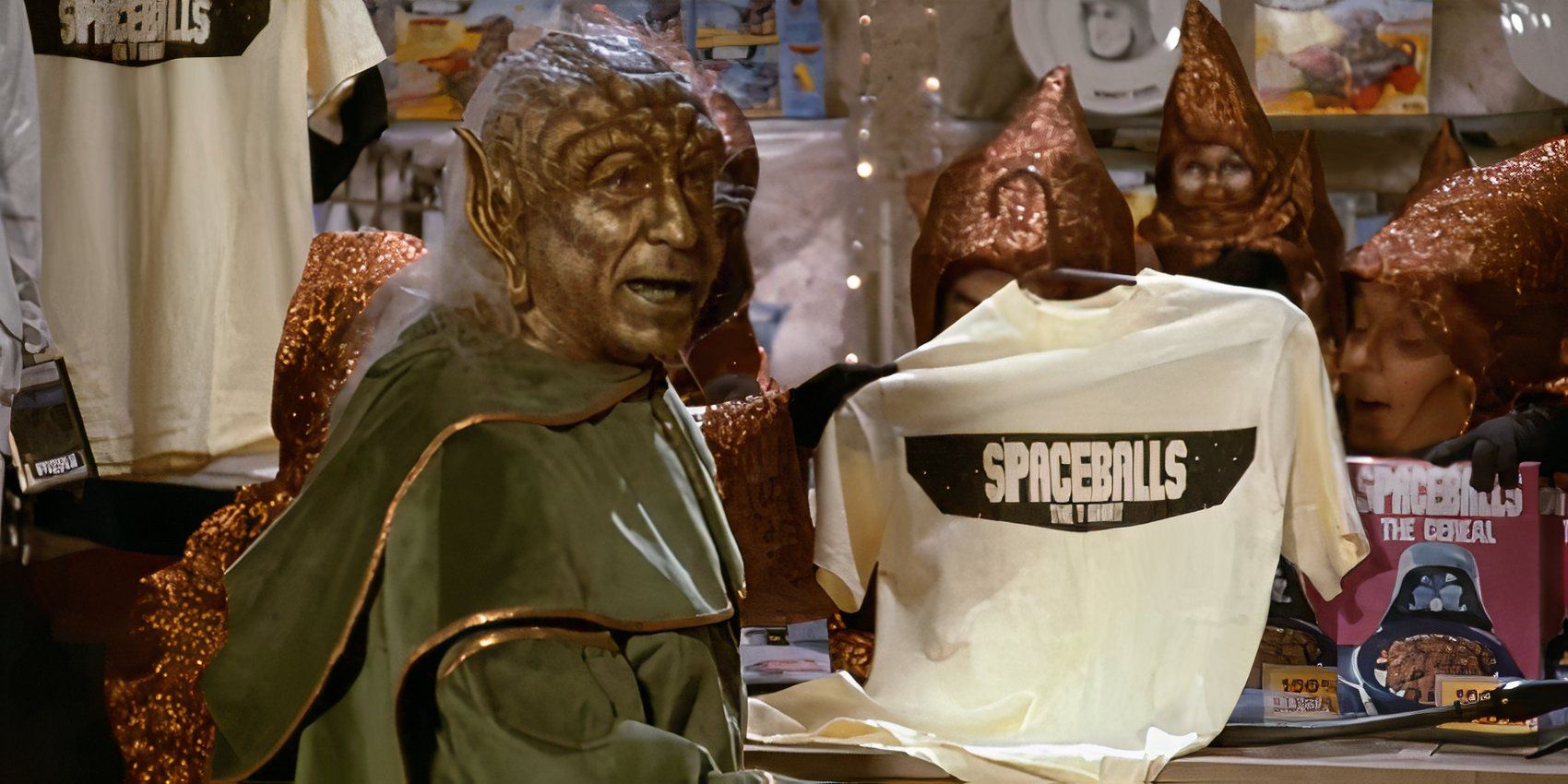 Mel Brooks as Yogurt sells merchandise in Spaceballs