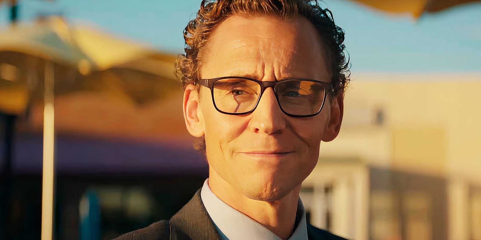 Tom Hiddleston smiling as Charles Krantz in The Life of Chuck