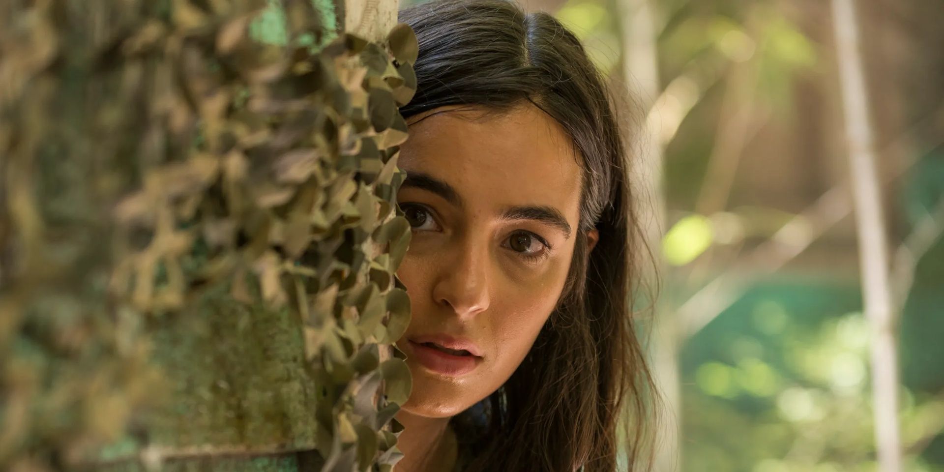 Tara looks around a corner in The Walking Dead