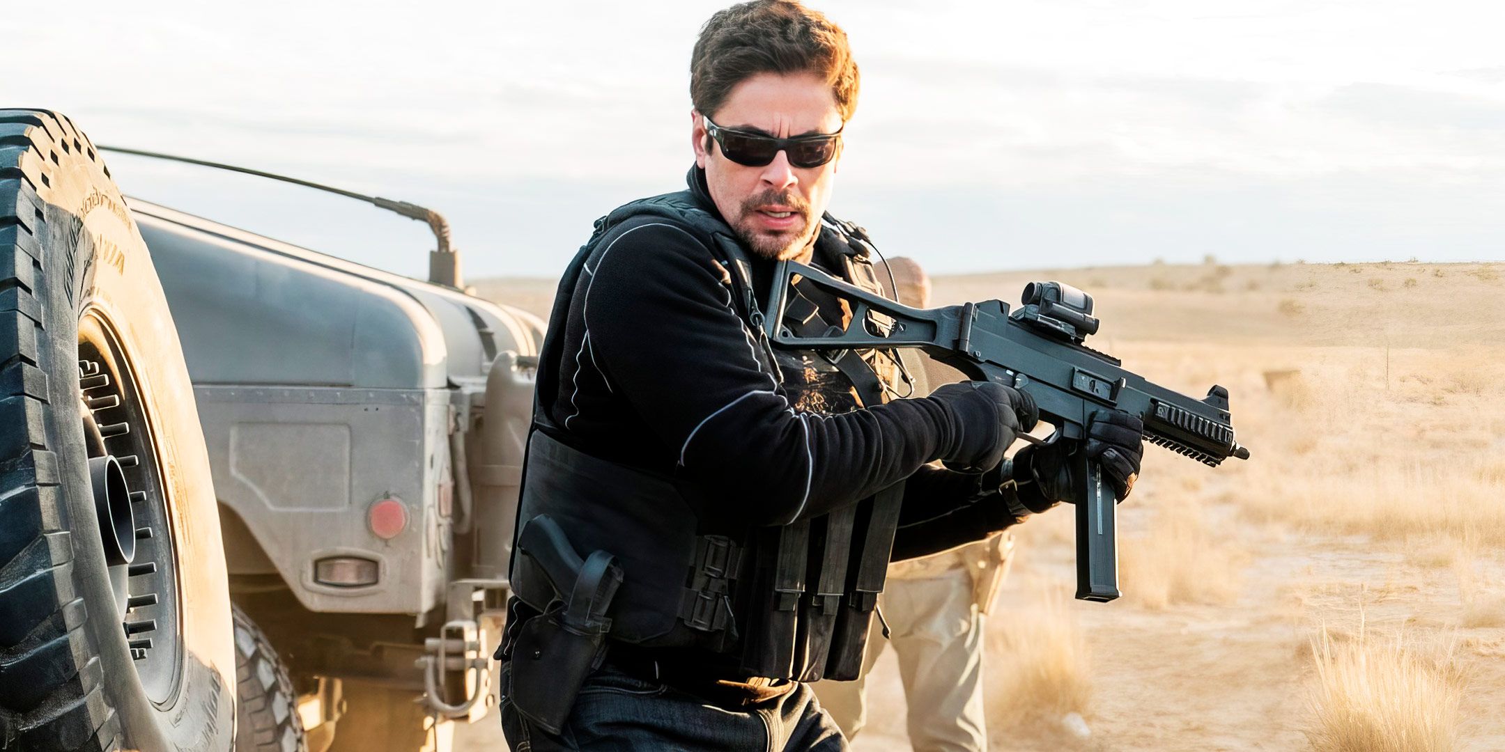 Benicio del Toro as Alejandro Gillick with a big gun in Sicario: Day of the Soldado.