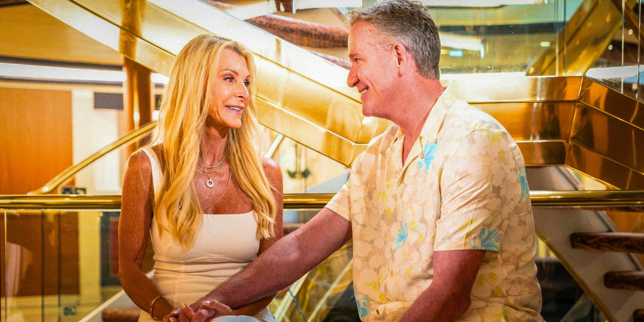 The Golden Bachelorette’s Joan Vassos and Chock Chapple lovingly look into each other's eyes while holding hands