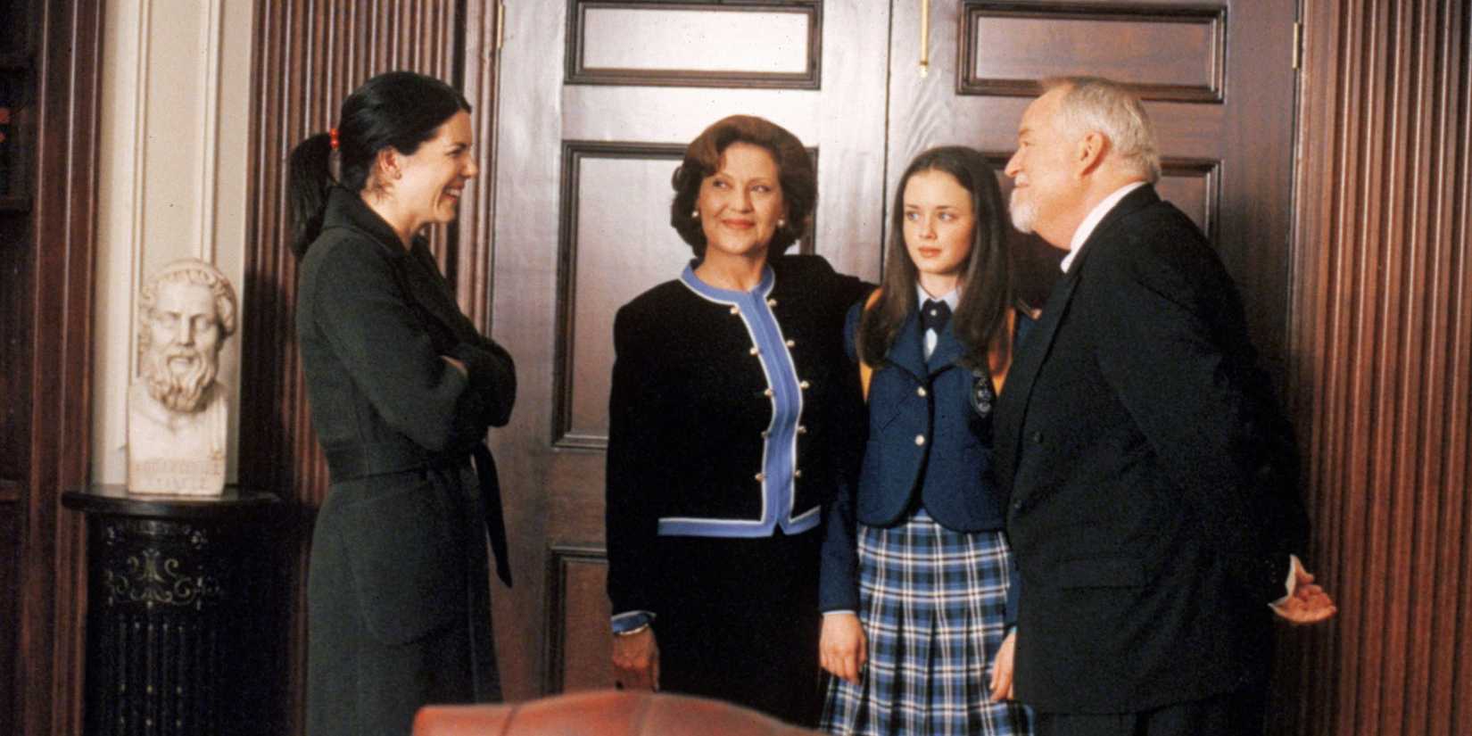 Lorelai, Emily, Rory, and Headmaster Charlston standing in Charlston's Chilton office in Gilmore Girls