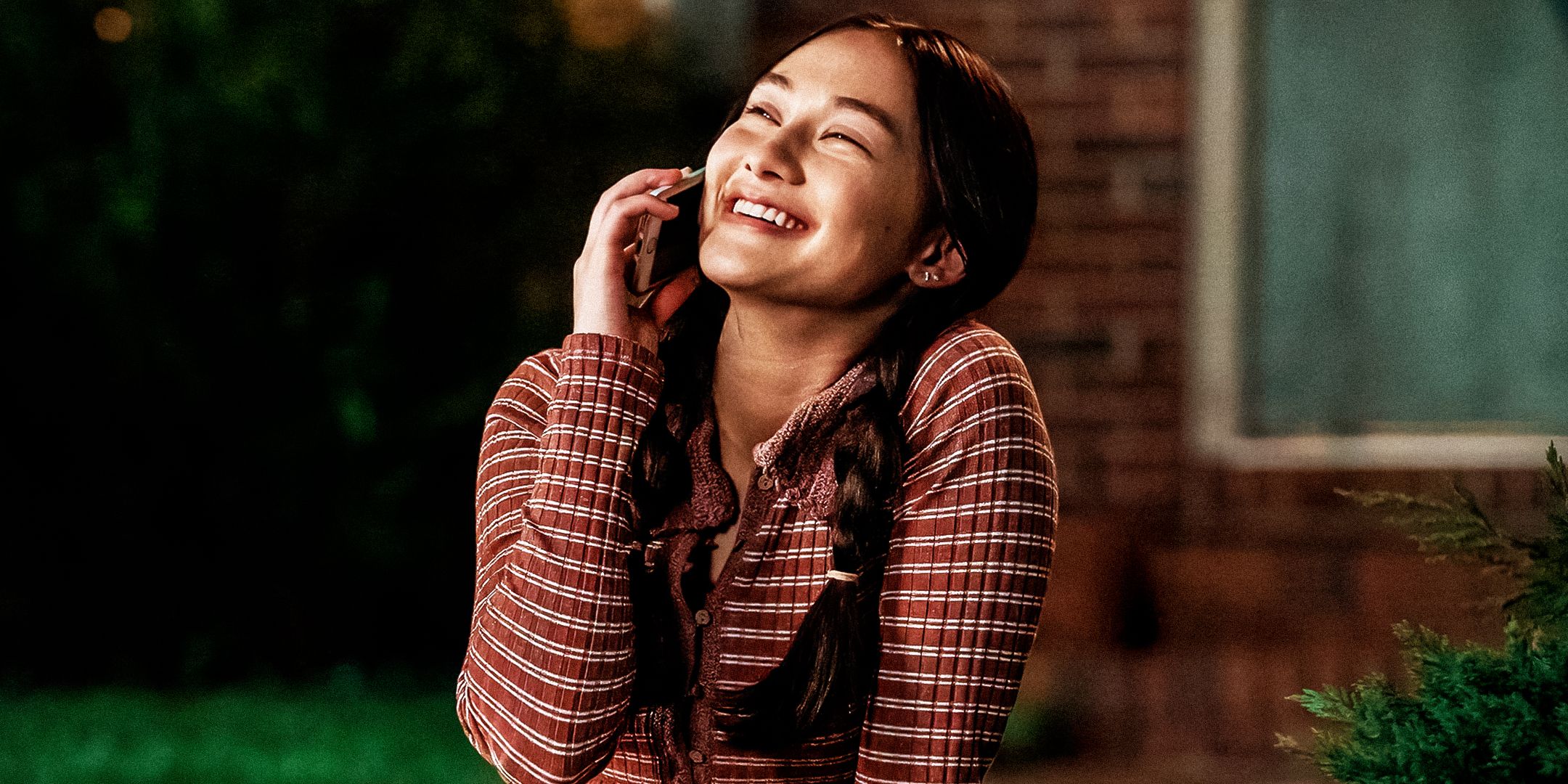 Lola Tung laughing in The Summer I Turned Pretty