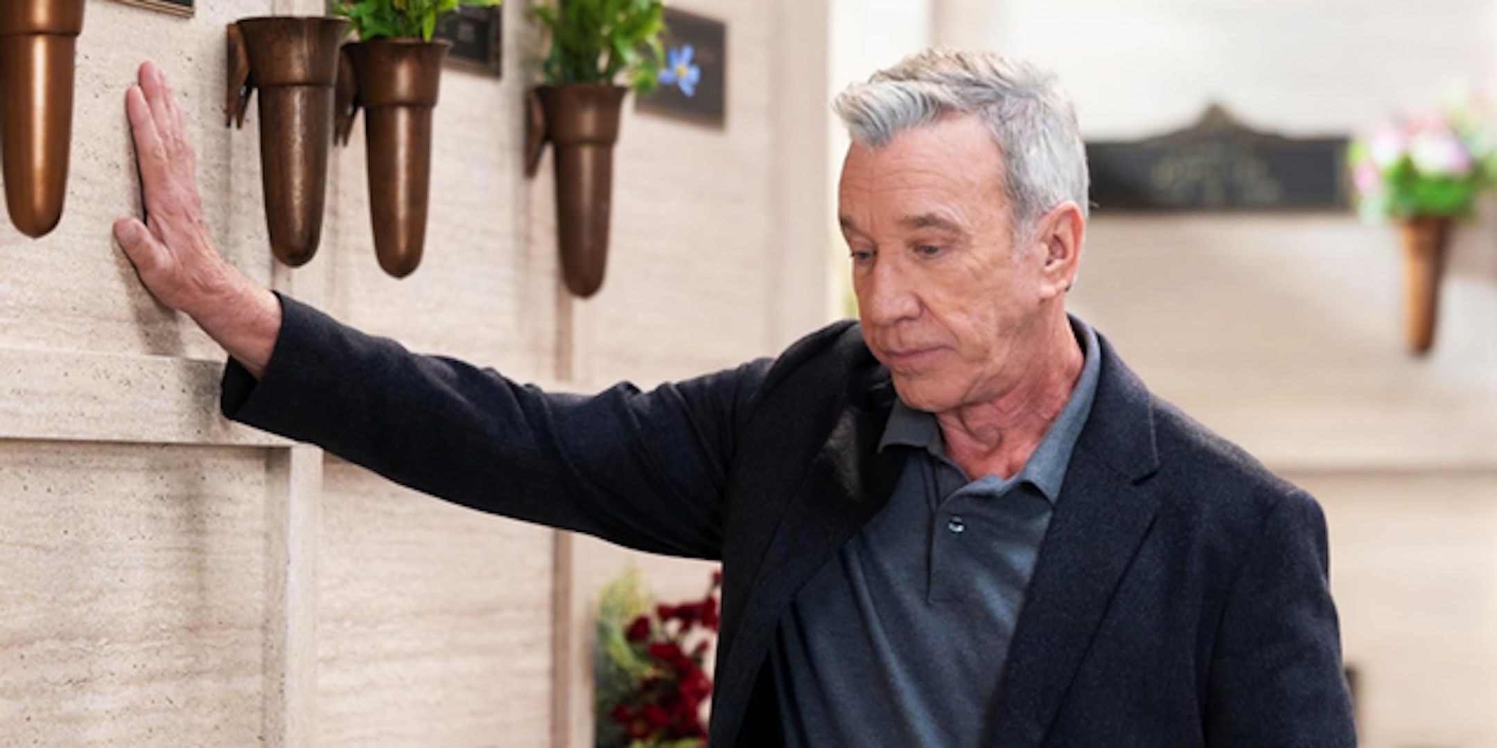 Tim Allen's Matt looks dejected in the auto shop from Shifting Gears season 1