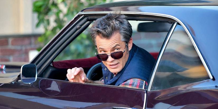 Timothy Olyphant looking out his car window in The Grinder