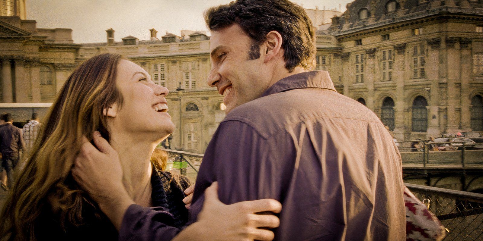 Ben Affleck and Olga Kurylenko laughing together in To the Wonder