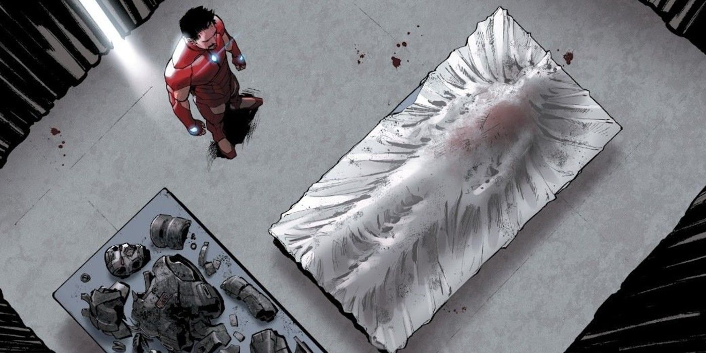 Tony Stark Iron Man views the dead body of James Rhodey Rhodes War Machine in Civil War II #1