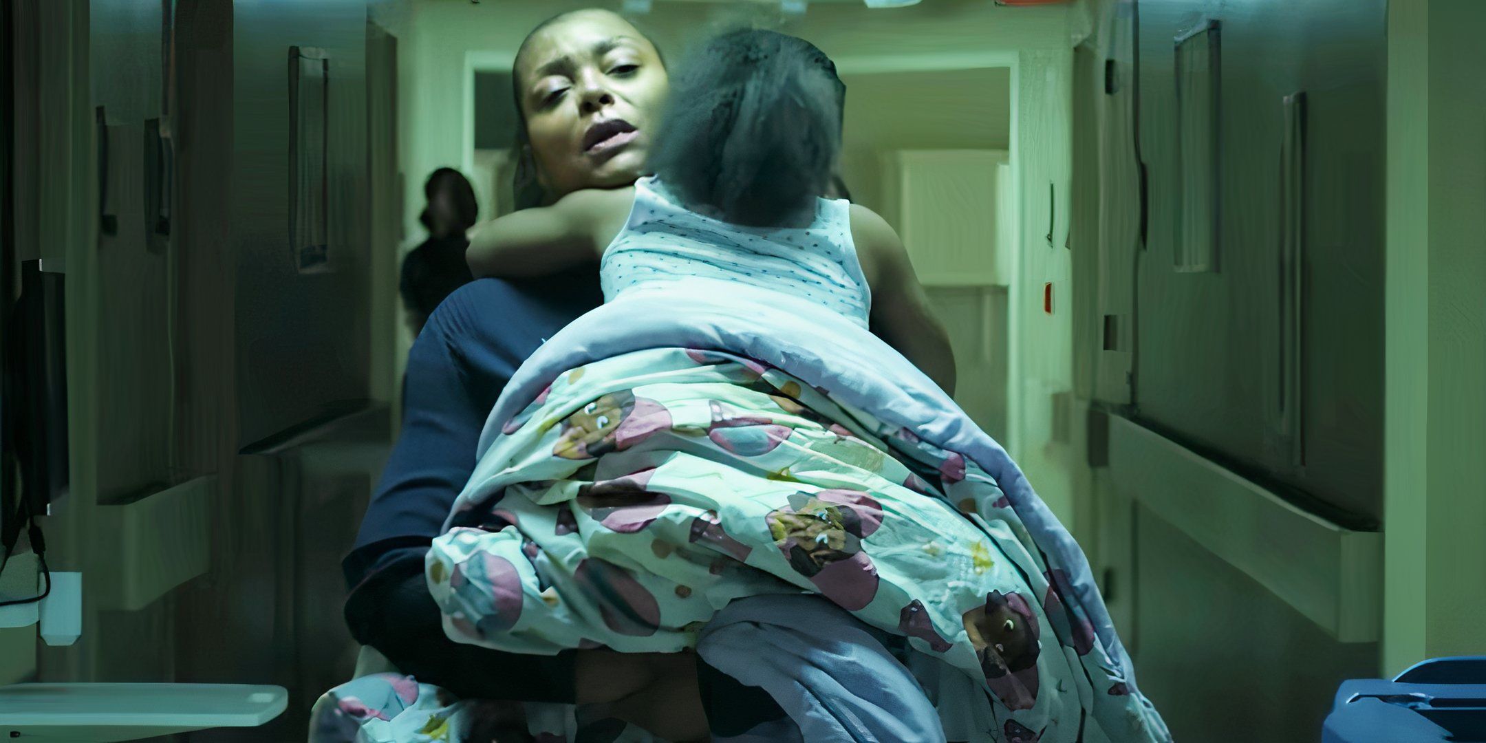 Taraji P. Henson as Janiyah carrying Aria down a hospital hallway in Straw