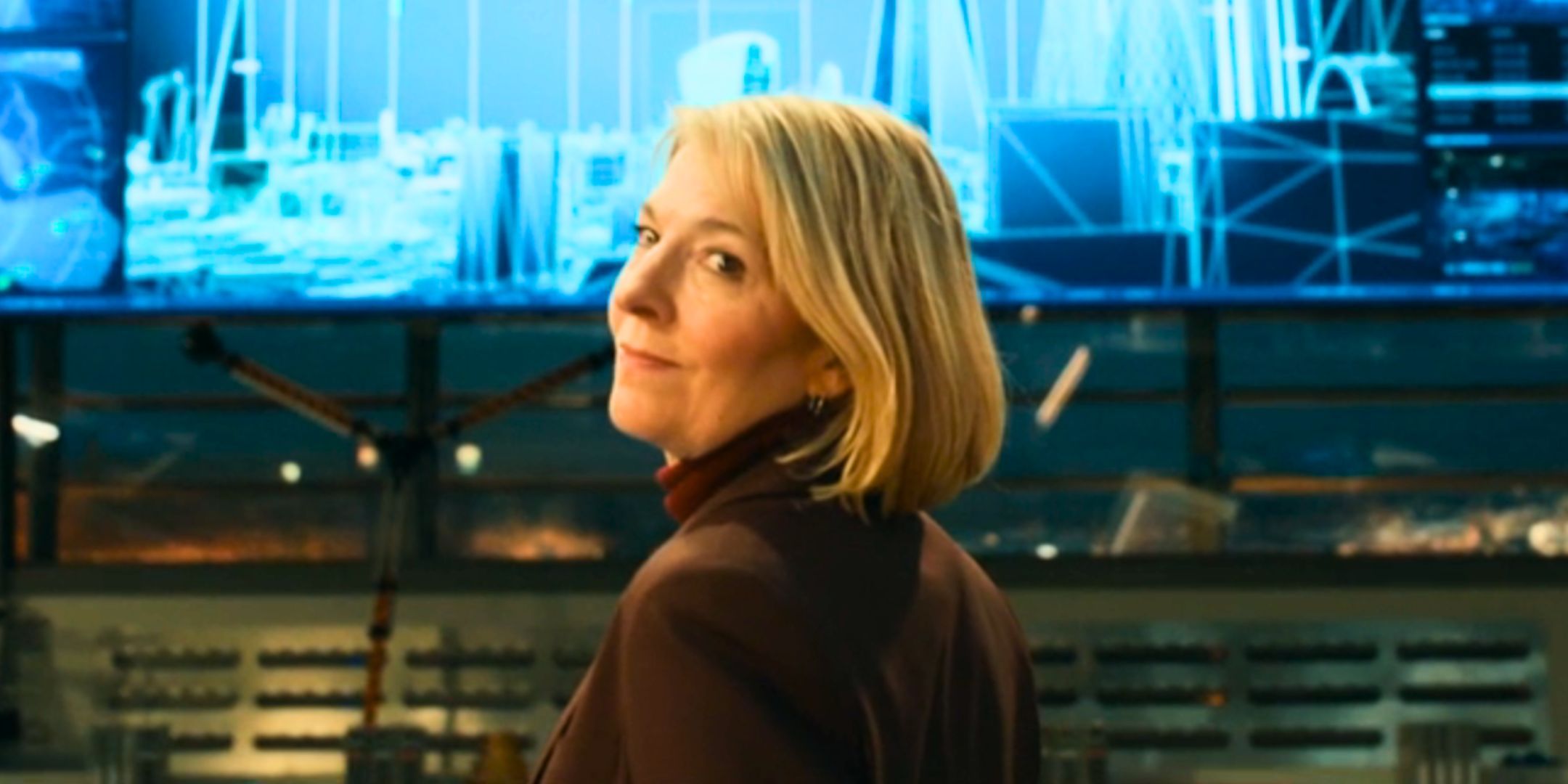 Jemma Redgrave as Kate Stewart smiling over her shoulder in Doctor Who
