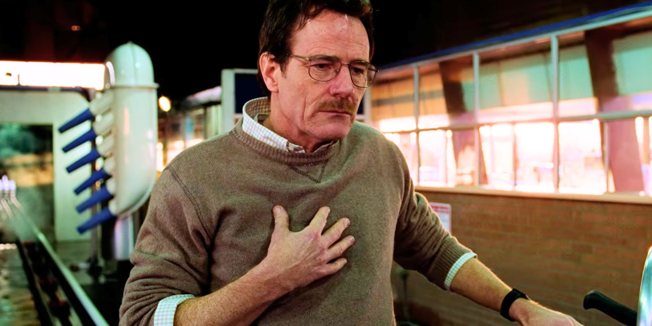 Bryan Cranston with his hand on his chest as Walter White in Breaking Bad