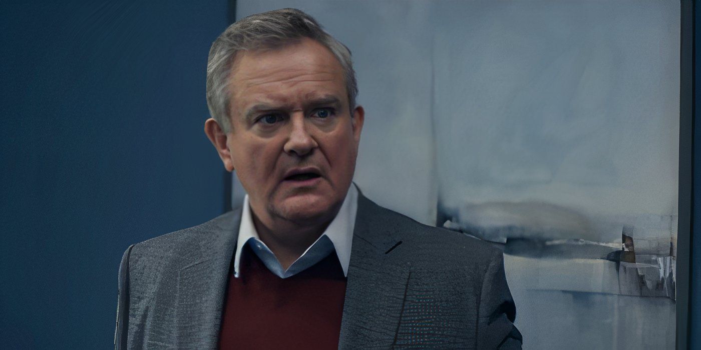 Hugh Bonneville as Douglas Bellowes looking stunned in the TV studio's hallway in Douglas Is Cancelled.