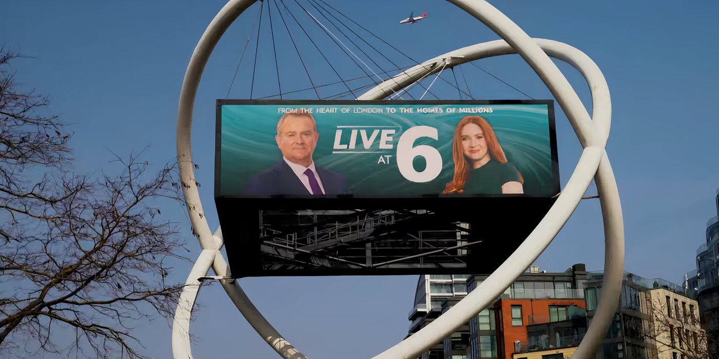 A billboard for Live at 6 News high in the sky, featuring Douglas and Madeline, in Douglas Is Cancelled.