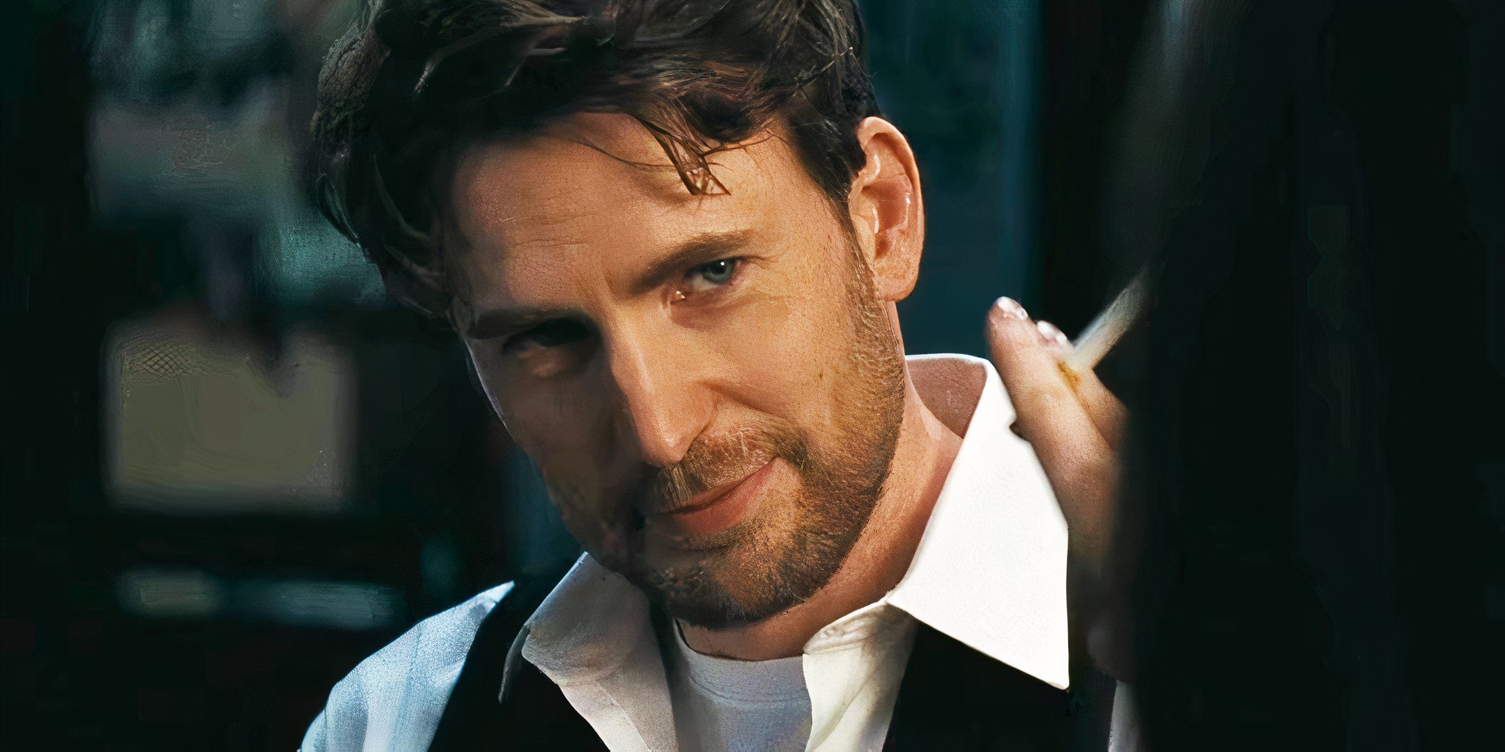 Chris Evans is staring and smiling in Materialists
