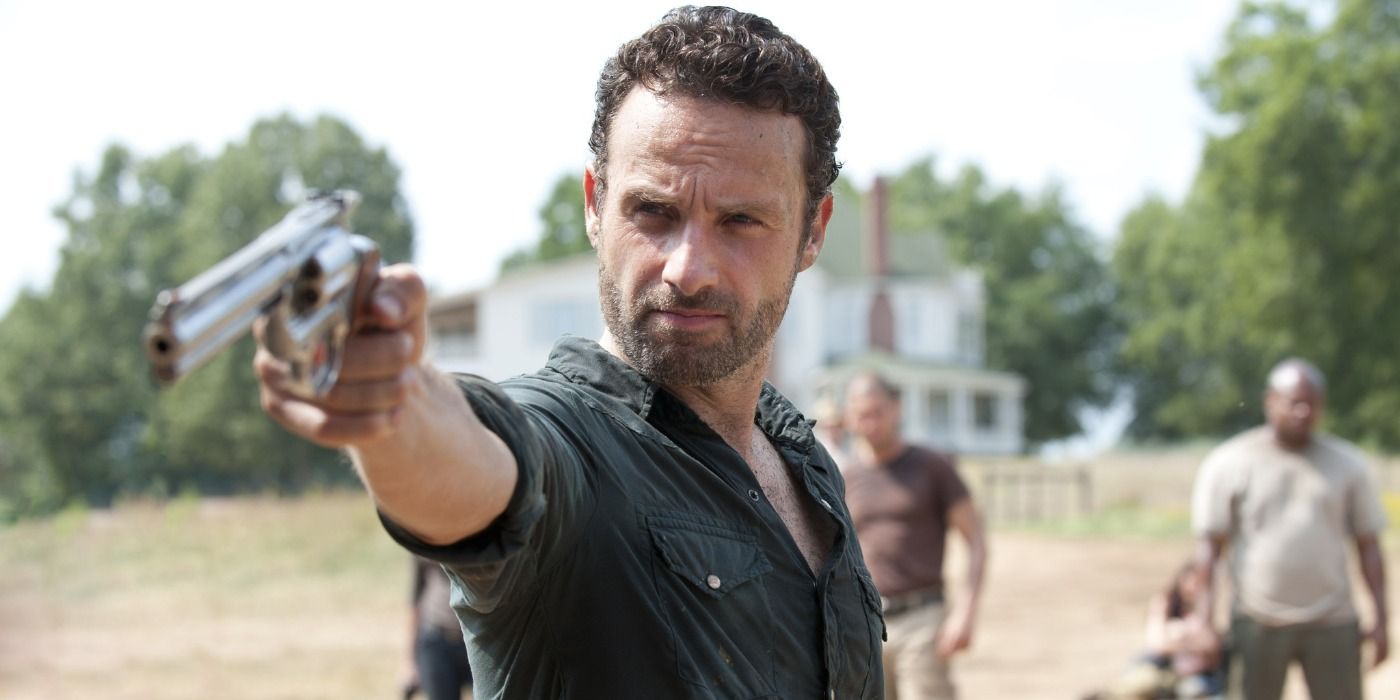 Andrew Lincoln as Rick Grimes pointing a gun in The Walking Dead