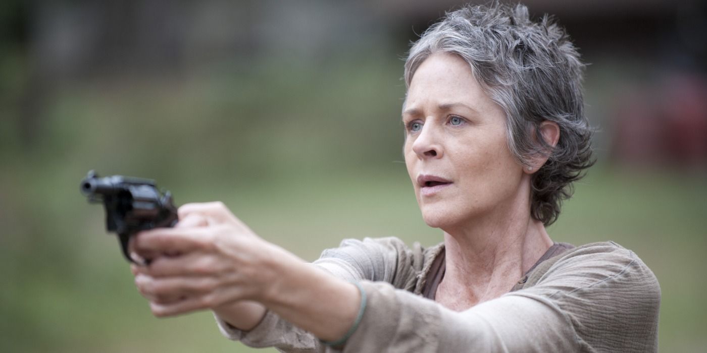 Carol points a gun in The Walking Dead