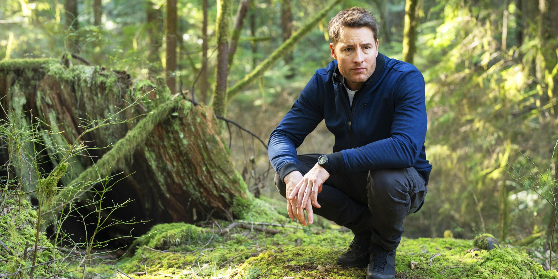 Justin Hartley as Colter Shaw, tracking someone in the woods in Tracker