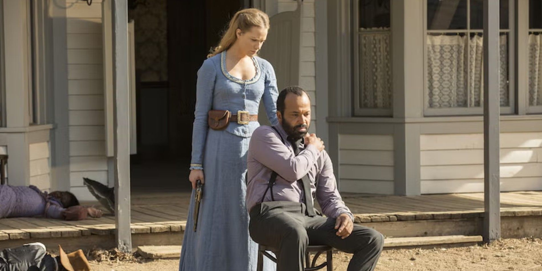 Dolores (Evan Rachel Wood) with her hand on Bernard's (Jeffrey Wright) shoulder in Westworld The Bicameral Mind