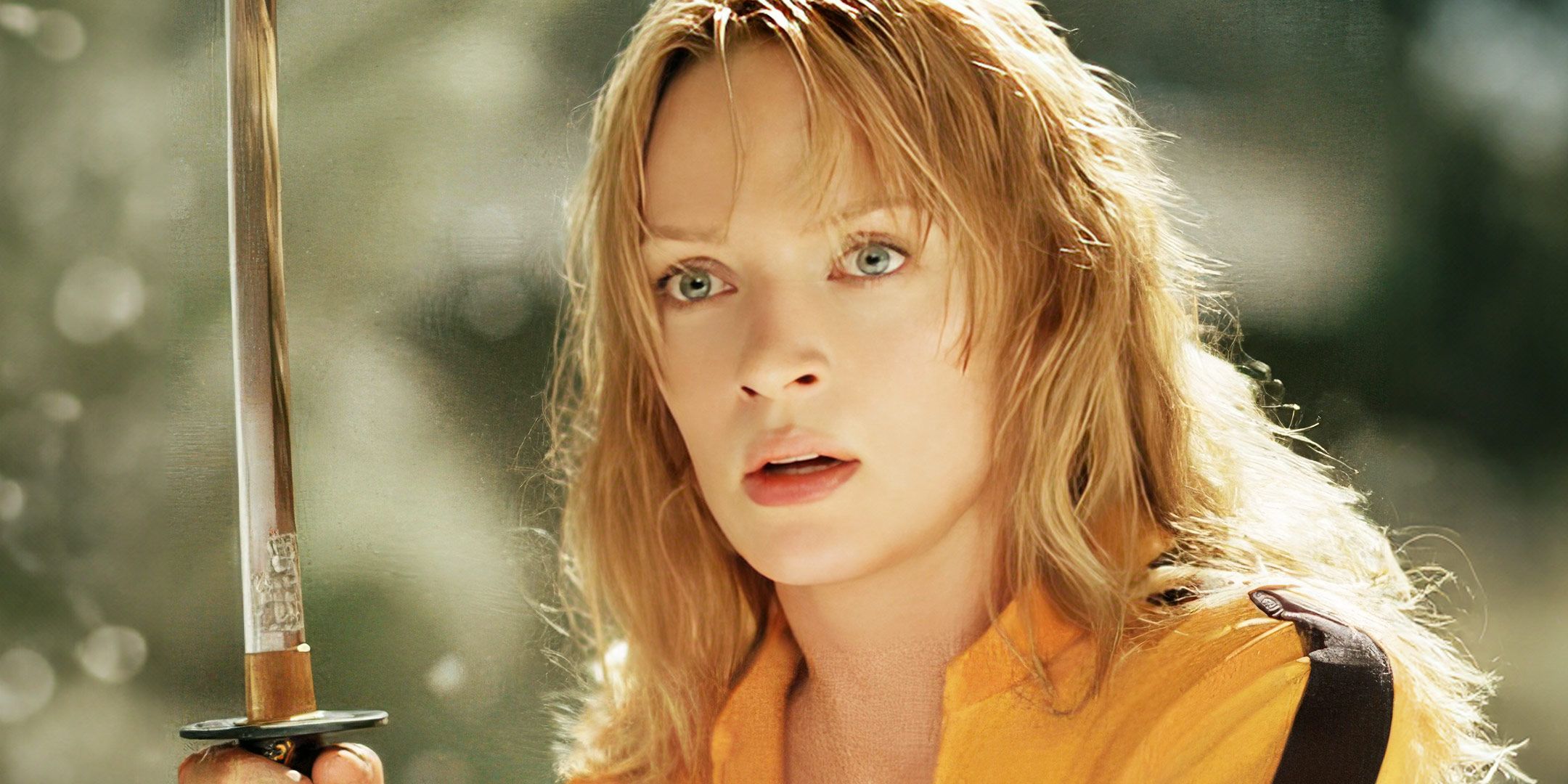 Uma Thurman as The Bride holding a sword in Kill Bill.