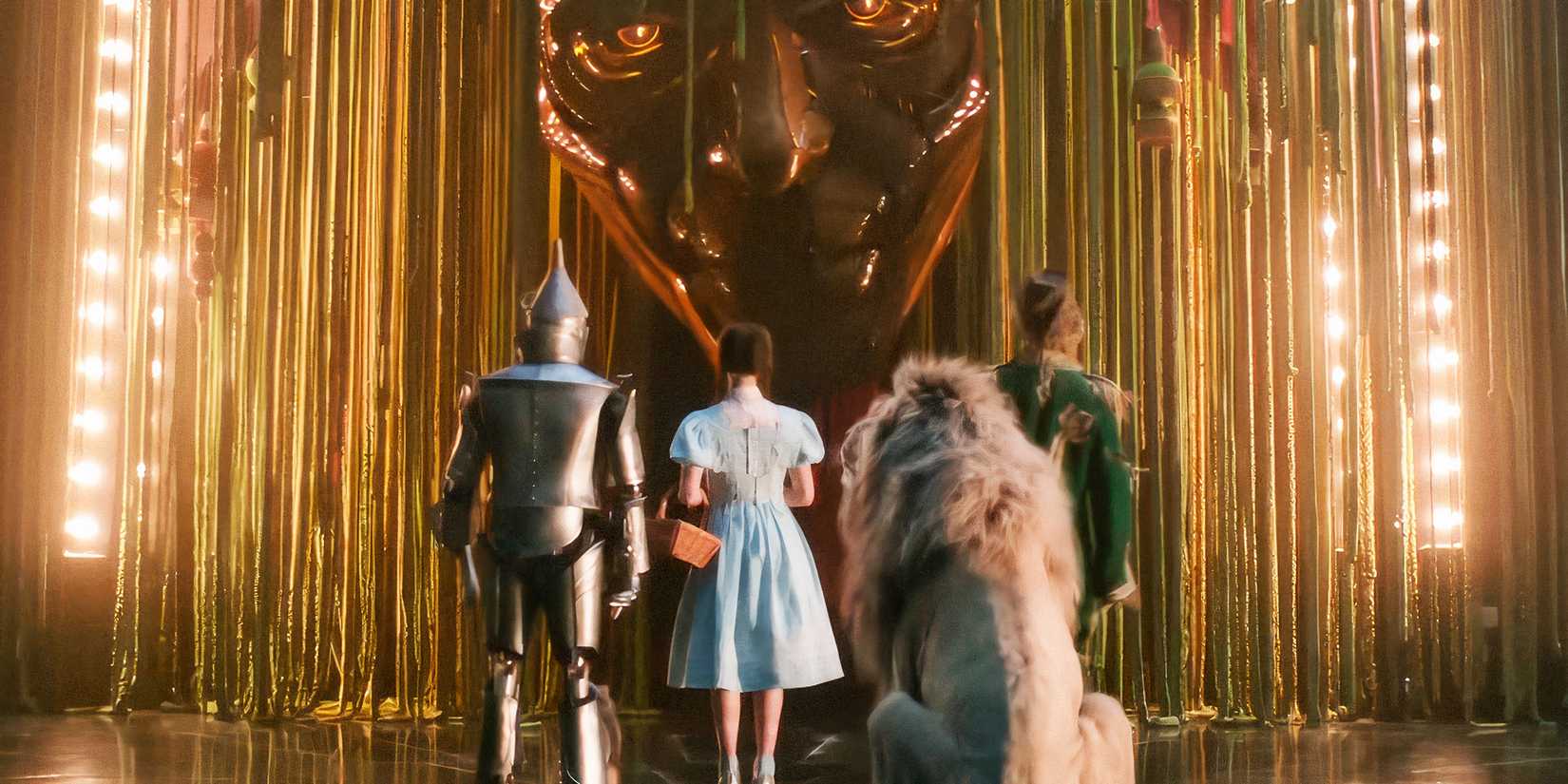 The Tin Man, Dorothy, Cowardly Lion, and Scarecrow speak with the Wizard of Oz in Wicked: For Good