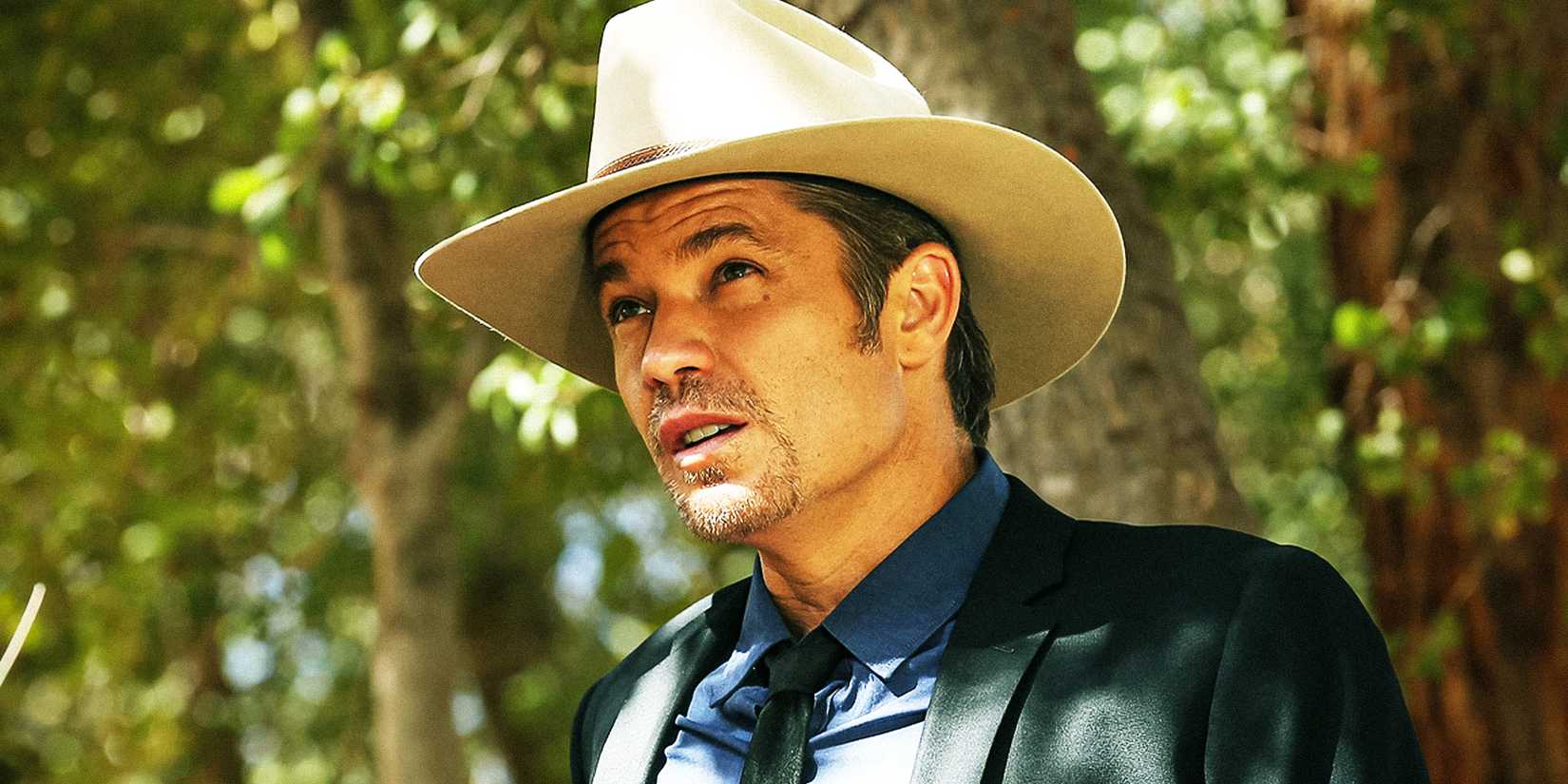 Timothy Olyphant looking up at something off camera in Justified