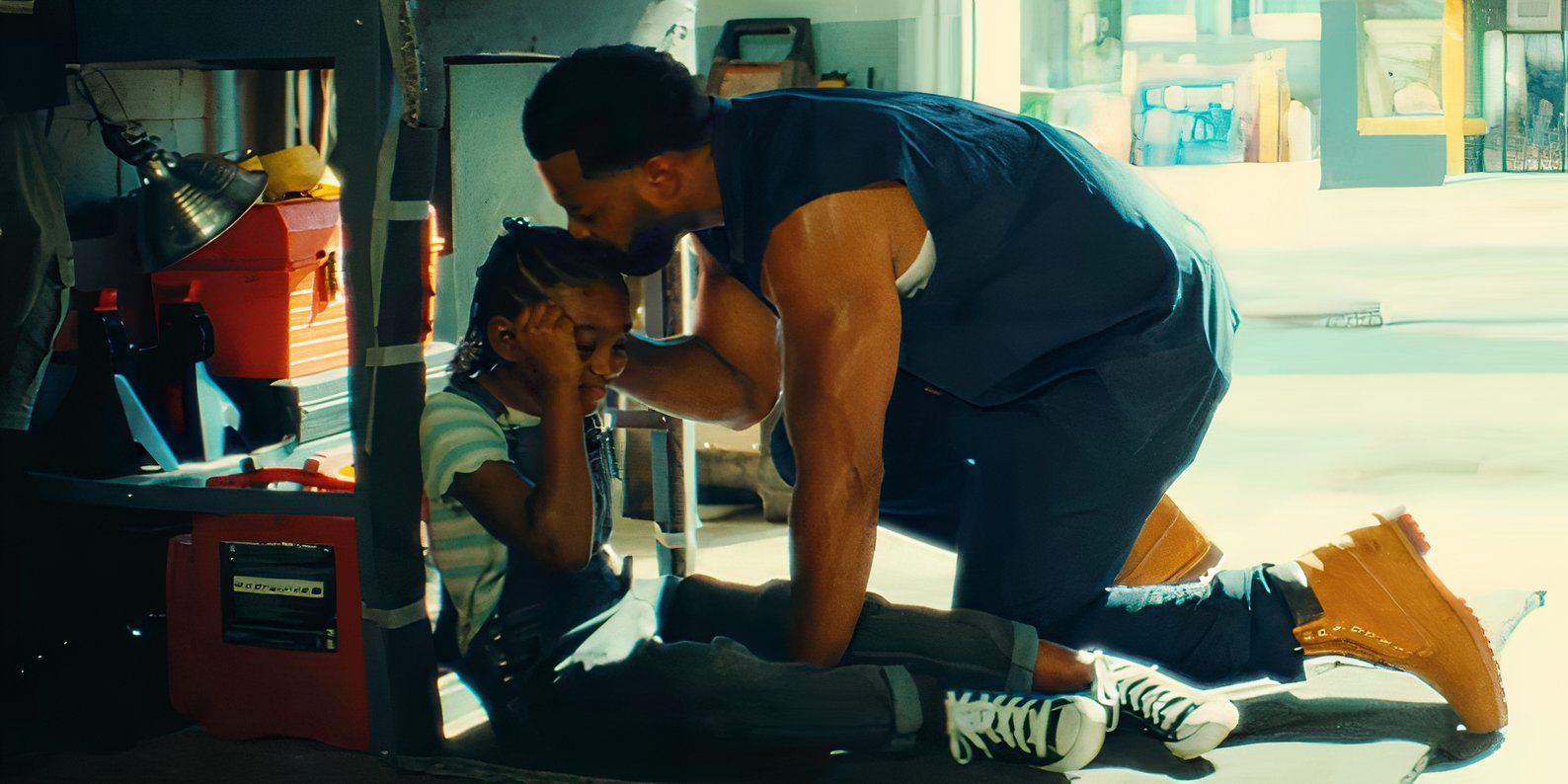 Young Riri and her stepdad (played by LaRoyce Hawkins) in Ironheart trailer