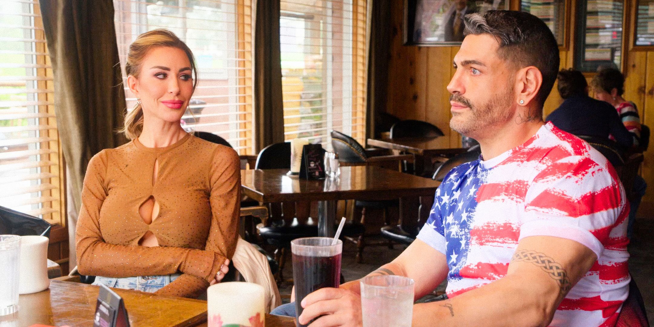 90 Day Fiancé’s Shekinah Garner looks over at Sarper Guven while sitting down to eat