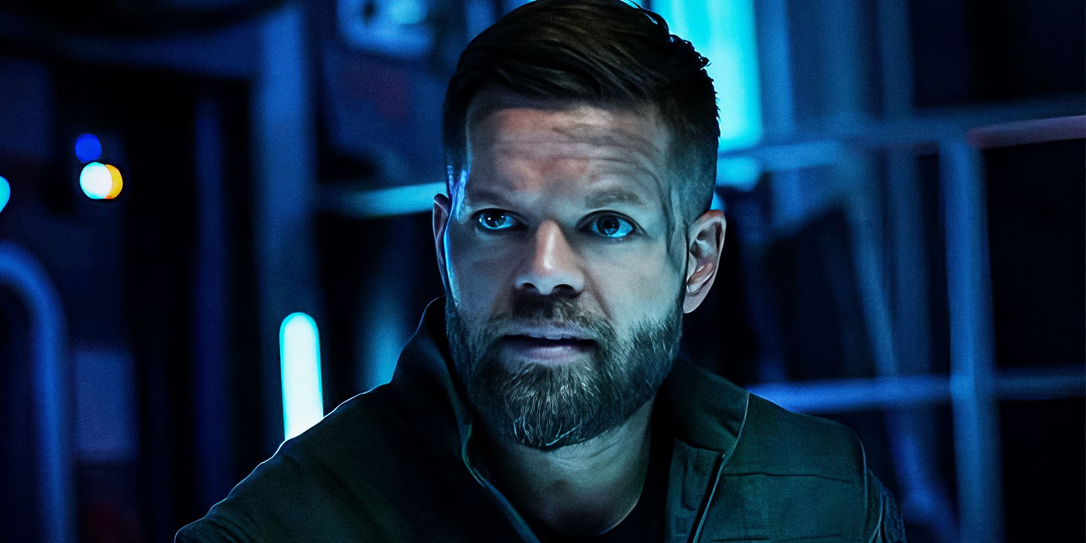 A male character from The Expanse looking at something offscreen
