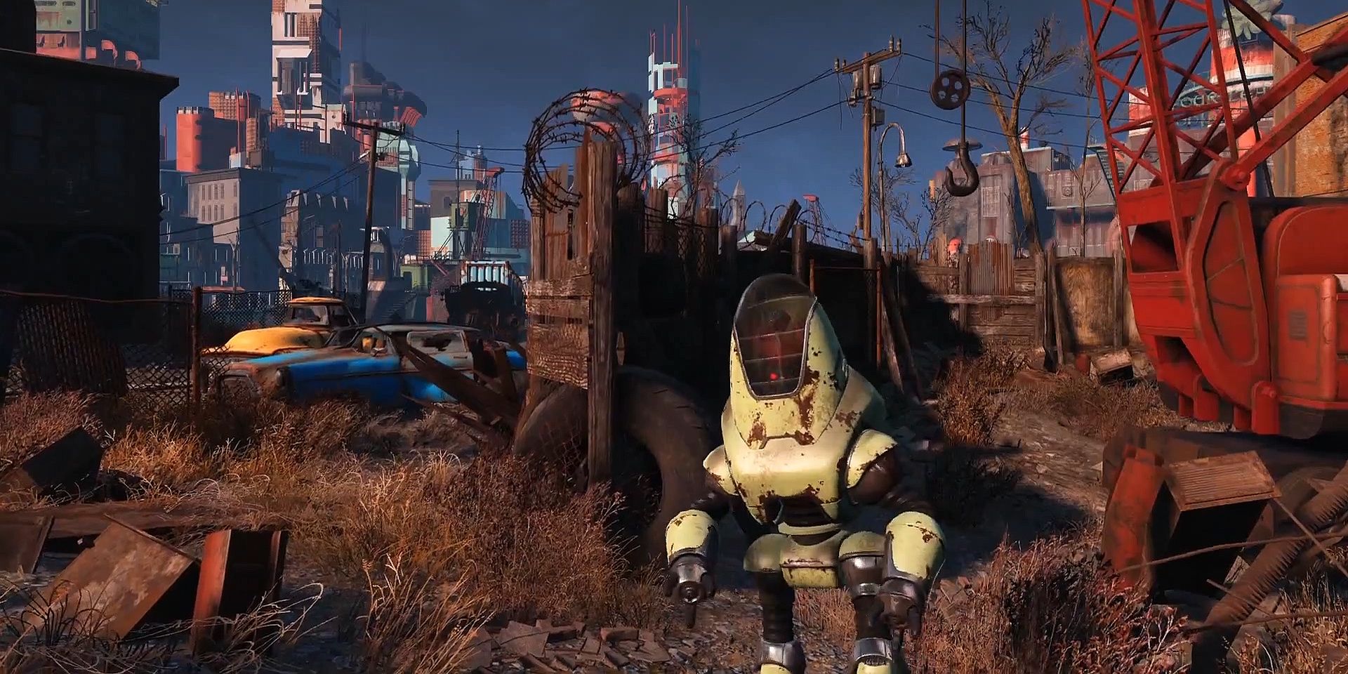 A Protectron stands in a junkyard from Fallout 4 Official Trailer