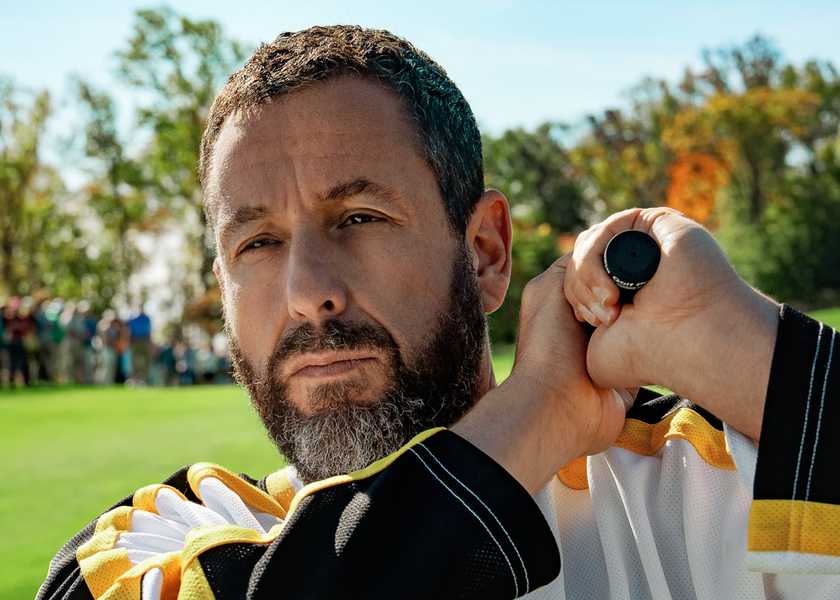 Adam Sandler swinging a golf club over his shoulder in Happy Gilmore 2