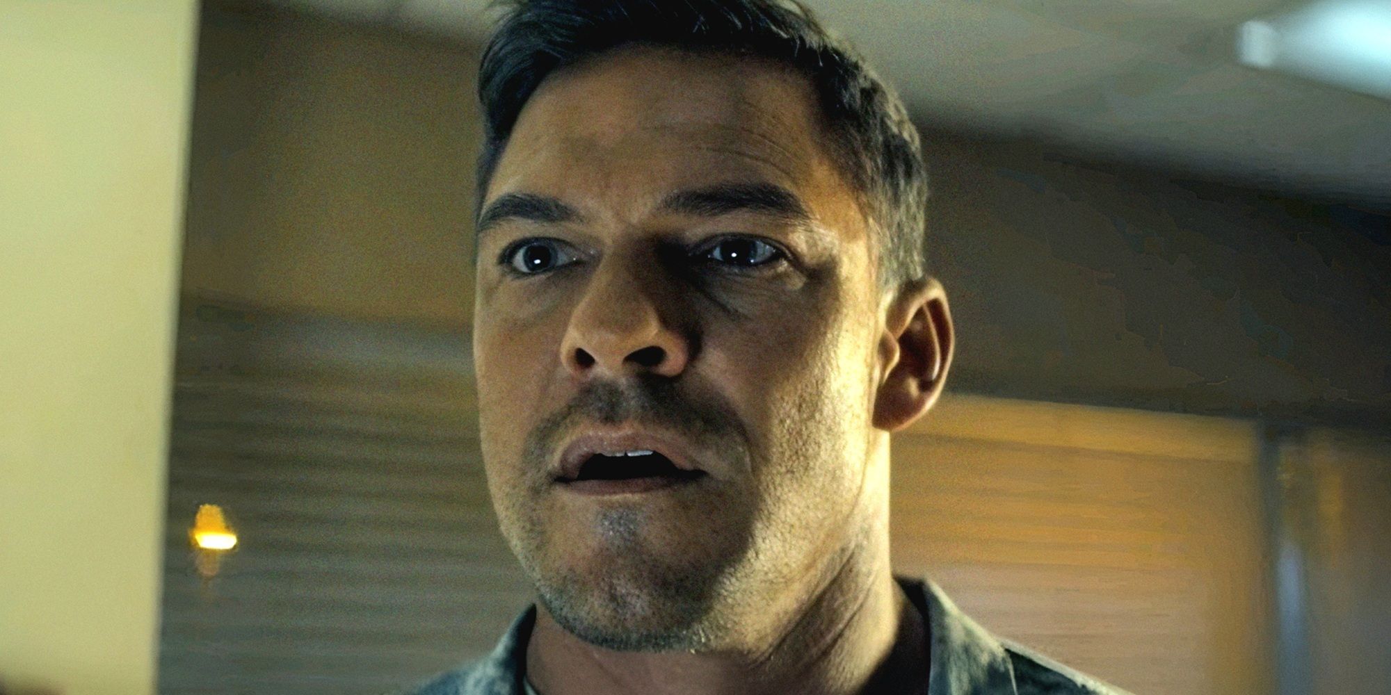Alan Ritchson looking surprised as Jack Reacher in Reacher season 3