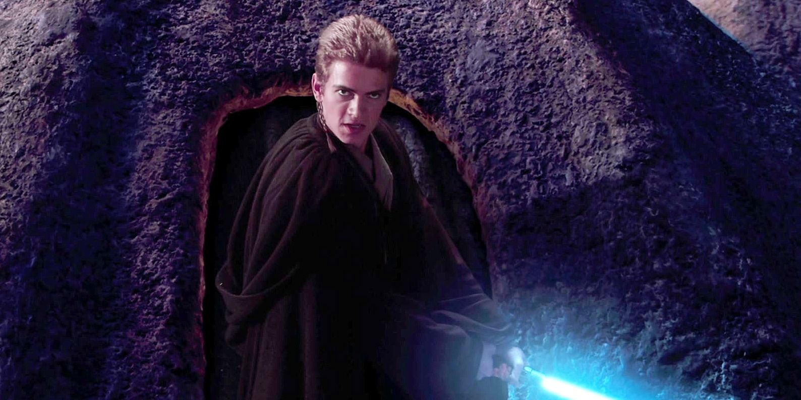Anakin looking angry and holding his blue lightsaber in Attack of the Clones