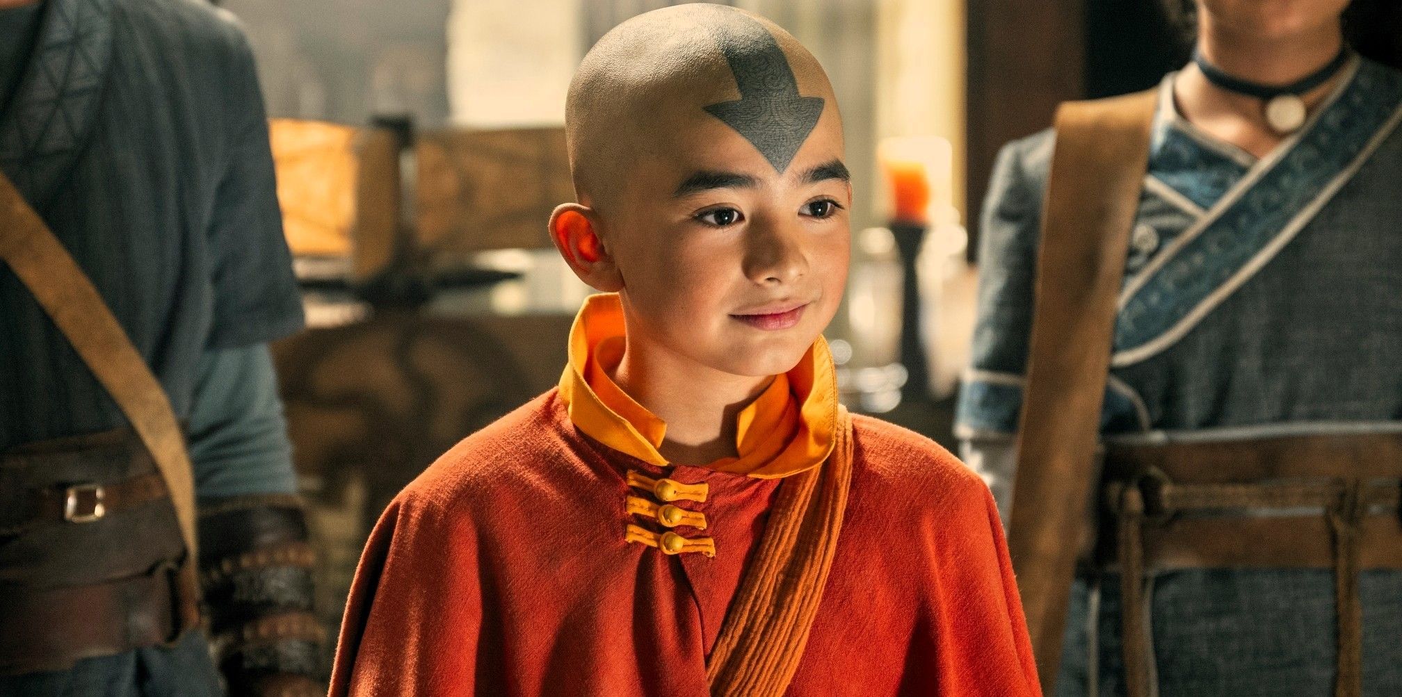 Aang smiles while looking to the side in Netflix's Avatar: The Last Airbender