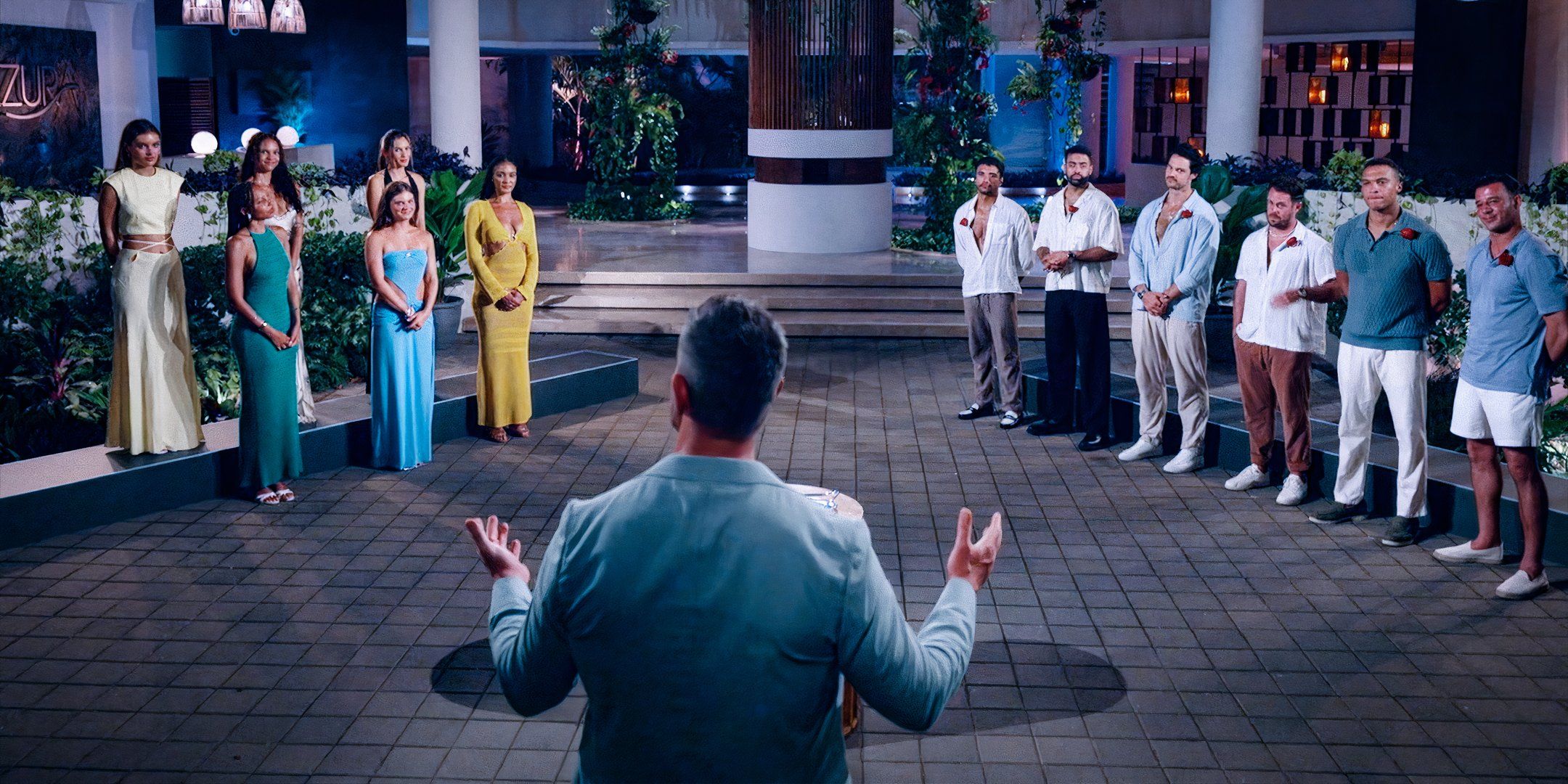 Bachelor In Paradise Season 10 cast separated by gender with host Jesse Palmer's back to the crowd.