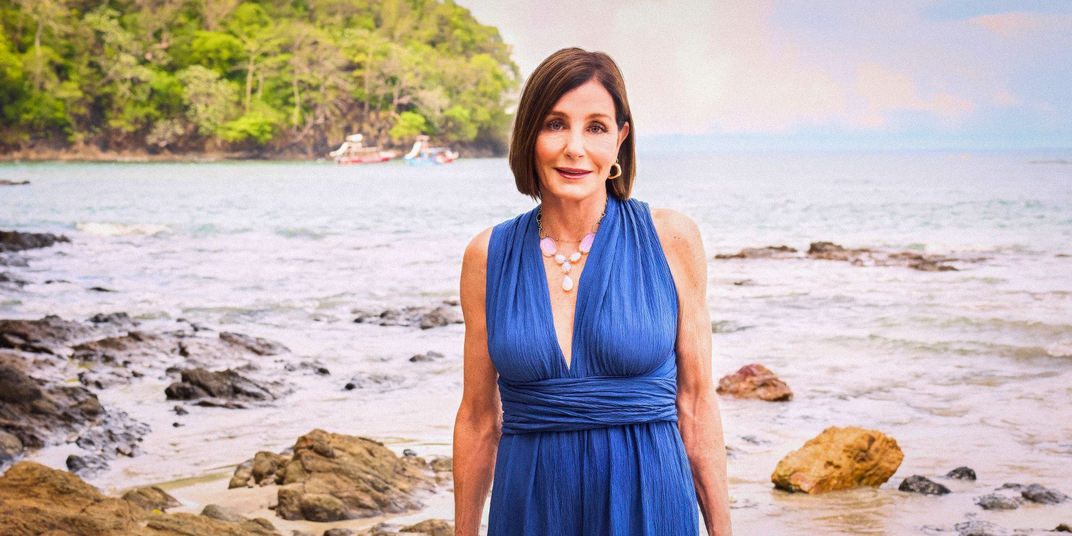 The Golden Bachelor and Bachelor in Paradise's Kathy Swarts wears a blue dress while on the beach